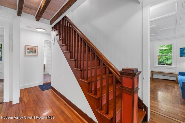 370 N Elting Corners Rd, Highland, NY 12528 - stairway featuring wood finished floors, baseboards, a baseboard heating unit, and wood ceiling with exposed beams