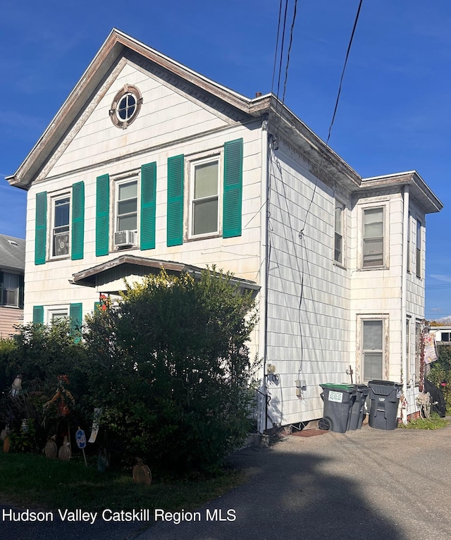 view of side of property with cooling unit