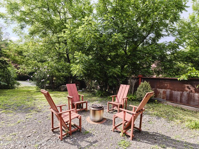 view of yard with an outdoor fire pit