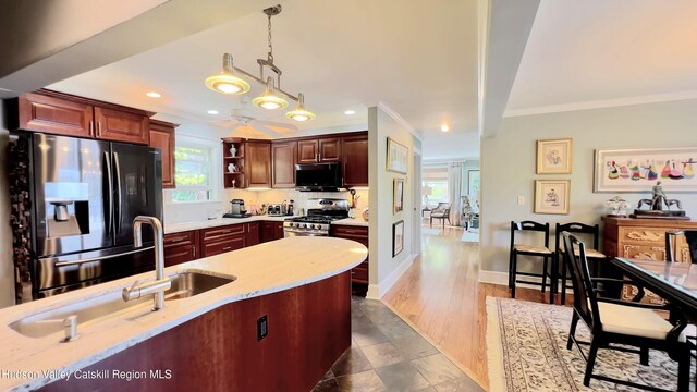 50 Manhattoes Dr, Athens, NY 12015 - kitchen with stainless steel appliances, ornamental molding, open shelves, healthy amount of natural light, and decorative light fixtures