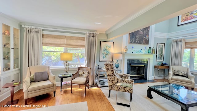 50 Manhattoes Dr, Athens, NY 12015 - living area featuring a fireplace with flush hearth, ornamental molding, and wood finished floors