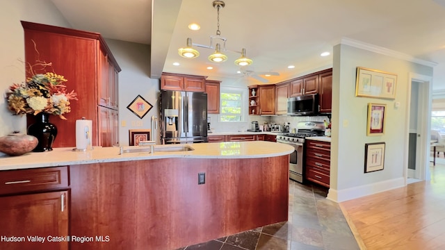 50 Manhattoes Dr, Athens, NY 12015 - kitchen featuring stainless steel appliances, a peninsula, a sink, ornamental molding, and tasteful backsplash