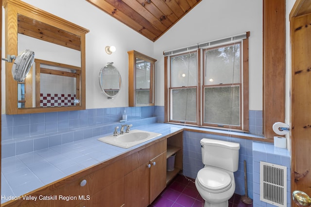 bathroom featuring toilet, tile patterned floors, wooden ceiling, lofted ceiling, and visible vents