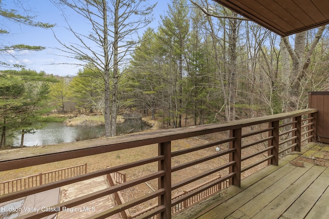 wooden deck with a water view