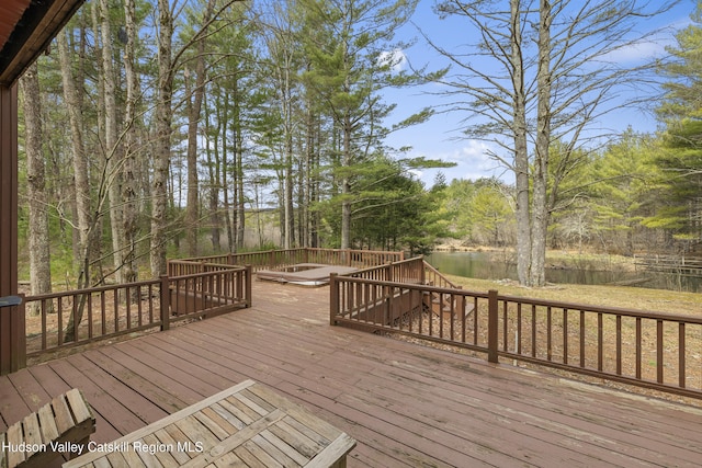 wooden terrace with a water view