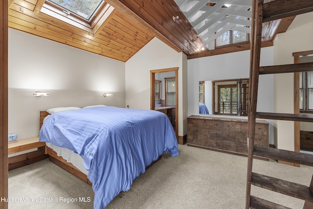 carpeted bedroom with wooden ceiling and lofted ceiling with skylight