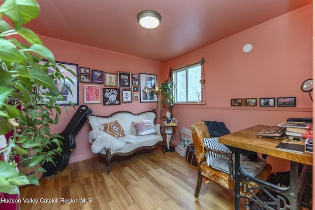 office space featuring crown molding and wood finished floors