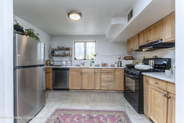 kitchen with visible vents, under cabinet range hood, open shelves, stainless steel appliances, and light countertops