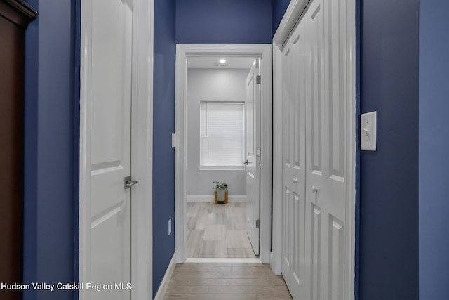 corridor featuring light hardwood / wood-style flooring