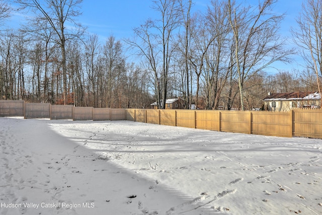 view of yard layered in snow