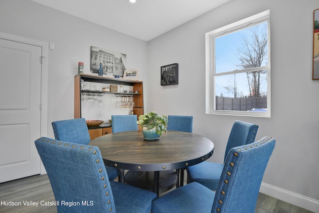 dining area with dark wood-type flooring