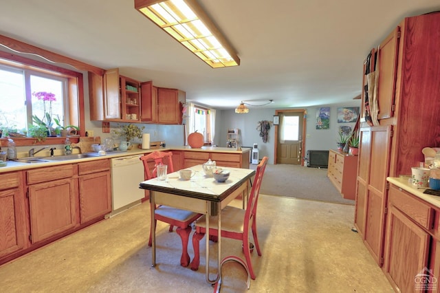 568 State Route 145, Middleburgh, NY 12122 - kitchen featuring white dishwasher, light countertops, a sink, and a peninsula