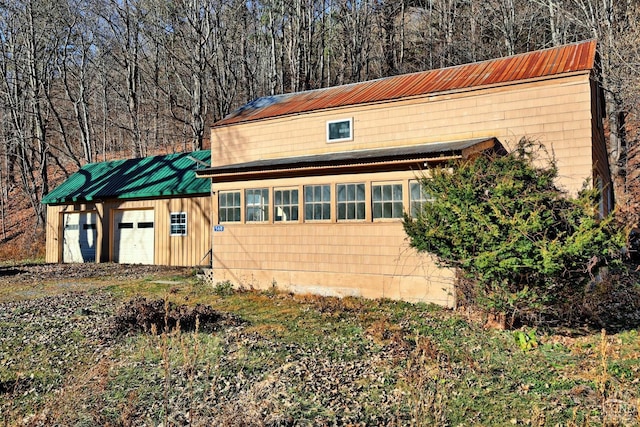 568 State Route 145, Middleburgh, NY 12122 - view of front of home featuring metal roof and a garage