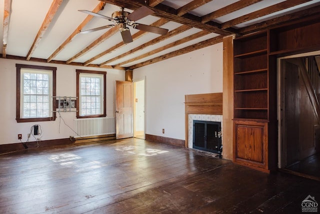21 Cemetery Rd, New Lebanon, NY 12125 - unfurnished living room with radiator, a fireplace, beam ceiling, a ceiling fan, and hardwood / wood-style floors