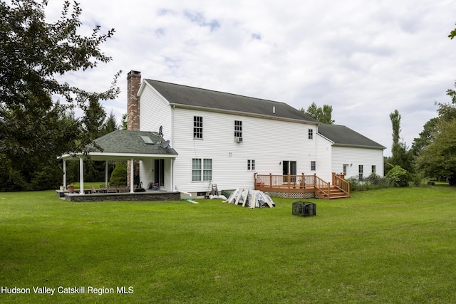 368 Gahbauer Rd, Hudson, NY 12534 - back of house with a chimney, a yard, a deck, and a patio area