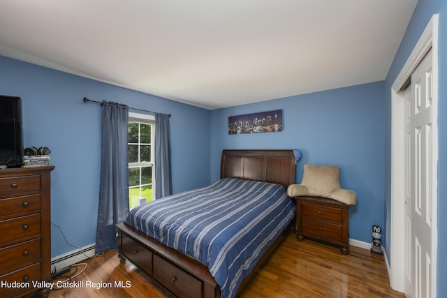 368 Gahbauer Rd, Hudson, NY 12534 - bedroom with a baseboard heating unit and wood finished floors