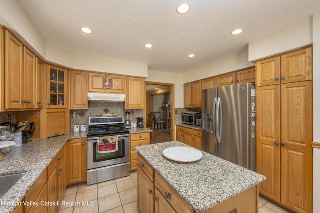 368 Gahbauer Rd, Hudson, NY 12534 - kitchen with appliances with stainless steel finishes, under cabinet range hood, backsplash, light stone counters, and recessed lighting