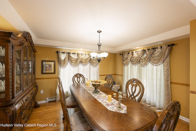368 Gahbauer Rd, Hudson, NY 12534 - dining space featuring a baseboard heating unit, light wood-type flooring, and a chandelier
