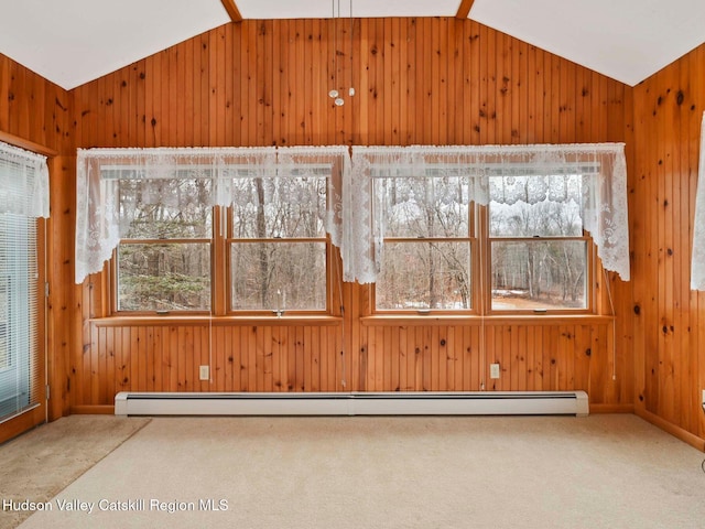 unfurnished sunroom featuring lofted ceiling, a wealth of natural light, and a baseboard heating unit