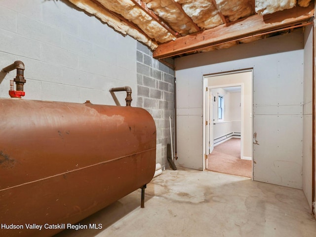 basement featuring a baseboard heating unit