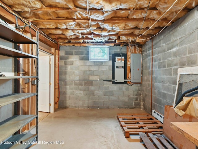 basement with baseboard heating and electric panel