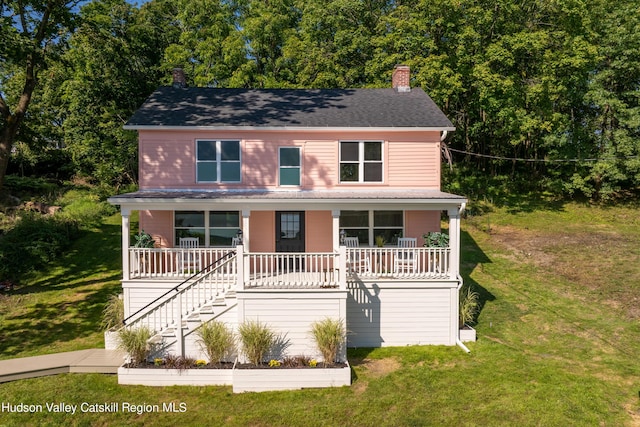 view of front of house featuring a porch and a front yard