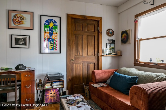 living area with a decorative wall