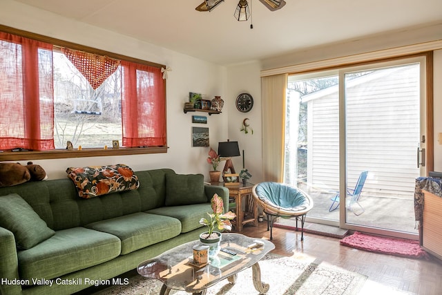living area with a ceiling fan