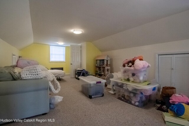 bonus room featuring carpet flooring and lofted ceiling