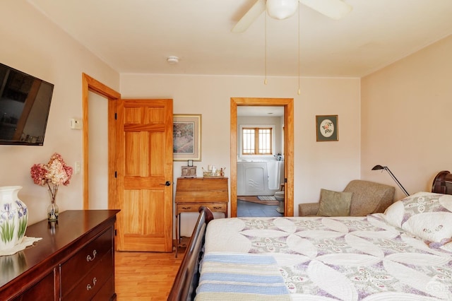 53 Snyder Pond Rd, Copake, NY 12516 - bedroom with light wood finished floors, ensuite bath, and a ceiling fan
