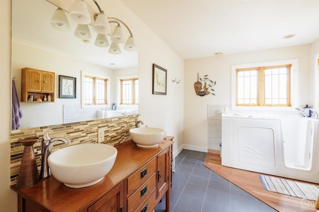 53 Snyder Pond Rd, Copake, NY 12516 - bathroom featuring decorative backsplash, tile patterned flooring, a bath, and double vanity