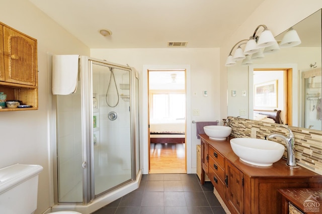 53 Snyder Pond Rd, Copake, NY 12516 - ensuite bathroom featuring decorative backsplash, double vanity, tile patterned floors, and a stall shower