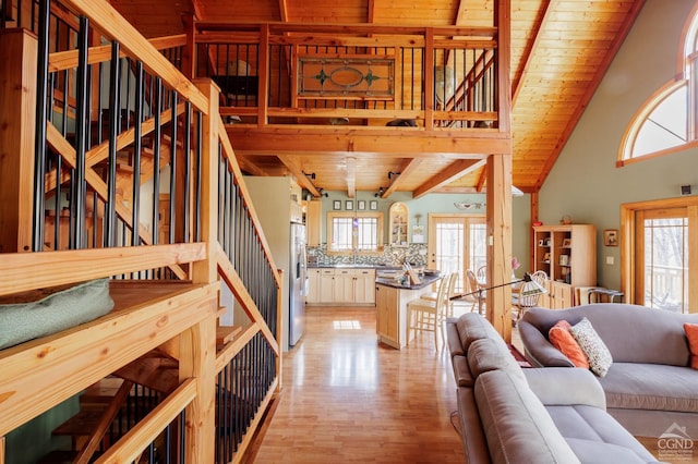 53 Snyder Pond Rd, Copake, NY 12516 - living room with a wooden ceiling with exposed beams, plenty of natural light, stairs, light wood finished floors, and high vaulted ceiling
