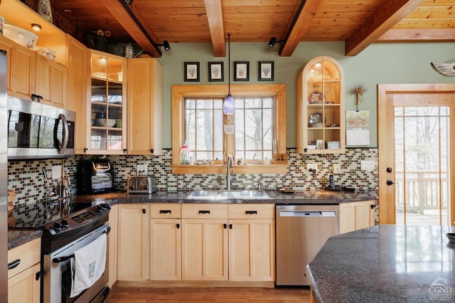 53 Snyder Pond Rd, Copake, NY 12516 - kitchen with appliances with stainless steel finishes, light wood-style flooring, backsplash, dark countertops, and glass insert cabinets