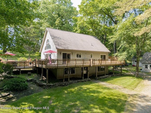 53 Snyder Pond Rd, Copake, NY 12516 - back of house featuring a wooden deck, a lawn, and a shingled roof