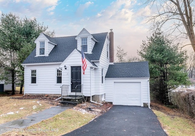 cape cod-style house with a garage