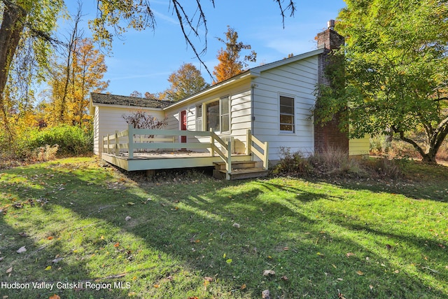 16-26 Shultis Brook Rd, Bearsville, NY 12409 - view of side of home featuring a wooden deck, a lawn, and a chimney