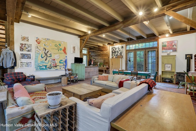 16-26 Shultis Brook Rd, Bearsville, NY 12409 - living area with french doors, plenty of natural light, wood finished floors, and a wood ceiling with exposed beams