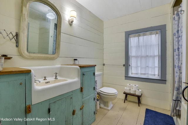 16-26 Shultis Brook Rd, Bearsville, NY 12409 - full bath featuring vanity, a shower with curtain, and wooden walls