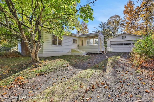 16-26 Shultis Brook Rd, Bearsville, NY 12409 - view of front of house featuring an outdoor structure, a detached garage, and entry steps