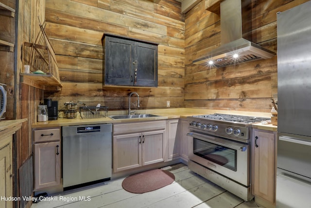 16-26 Shultis Brook Rd, Bearsville, NY 12409 - kitchen featuring appliances with stainless steel finishes, exhaust hood, wooden walls, and light countertops
