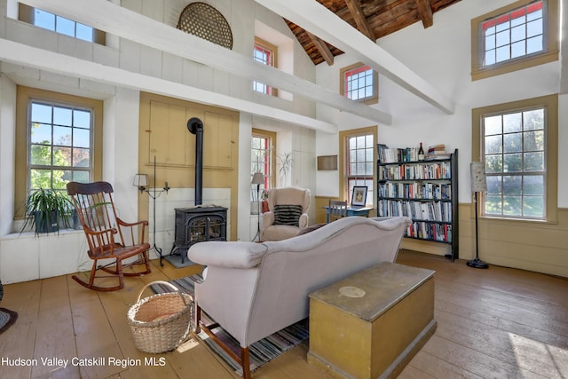 16-26 Shultis Brook Rd, Bearsville, NY 12409 - living room with wood-type flooring, a wood stove, high vaulted ceiling, and a wood ceiling with exposed beams