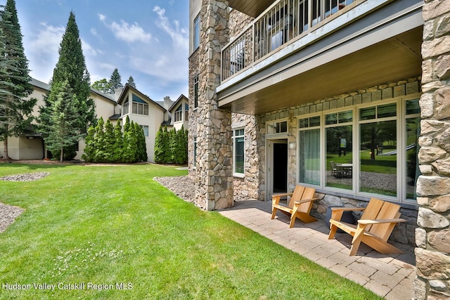 10 Enclave N Dr Unit 106, Windham, NY 12496 - view of green lawn featuring a balcony and a patio area