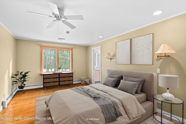 bedroom with ensuite bath, wood-type flooring, and ornamental molding