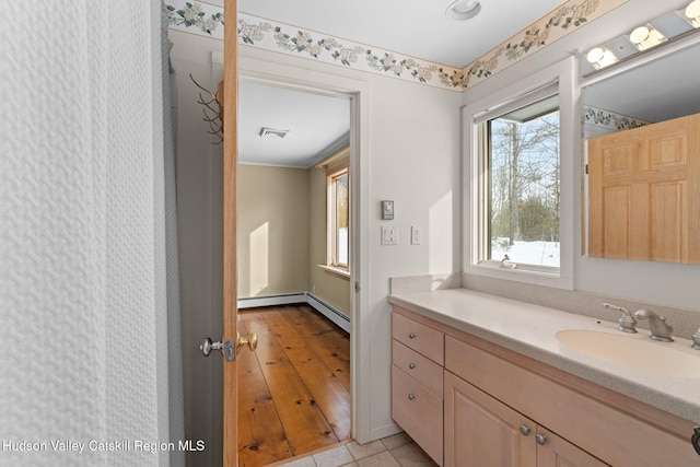 bathroom featuring tile patterned flooring and vanity