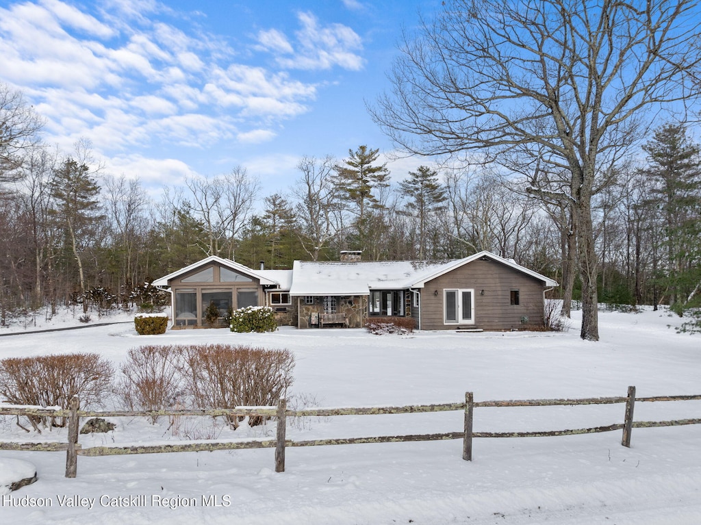 view of snow covered house