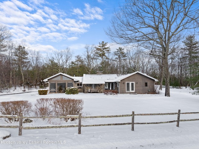 view of snow covered house