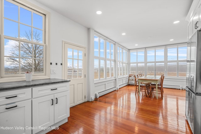 5868 Rte 209, Rochester, NY 12446 - sunroom / solarium with plenty of natural light, hardwood / wood-style floors, recessed lighting, and a baseboard heating unit