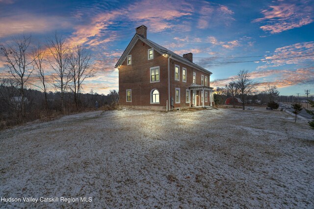 5868 Rte 209, Rochester, NY 12446 - property exterior at dusk with a chimney and brick siding