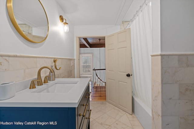 5868 Rte 209, Rochester, NY 12446 - full bath featuring vanity, tile walls, marble look tile flooring, shower / tub combo with curtain, and wainscoting